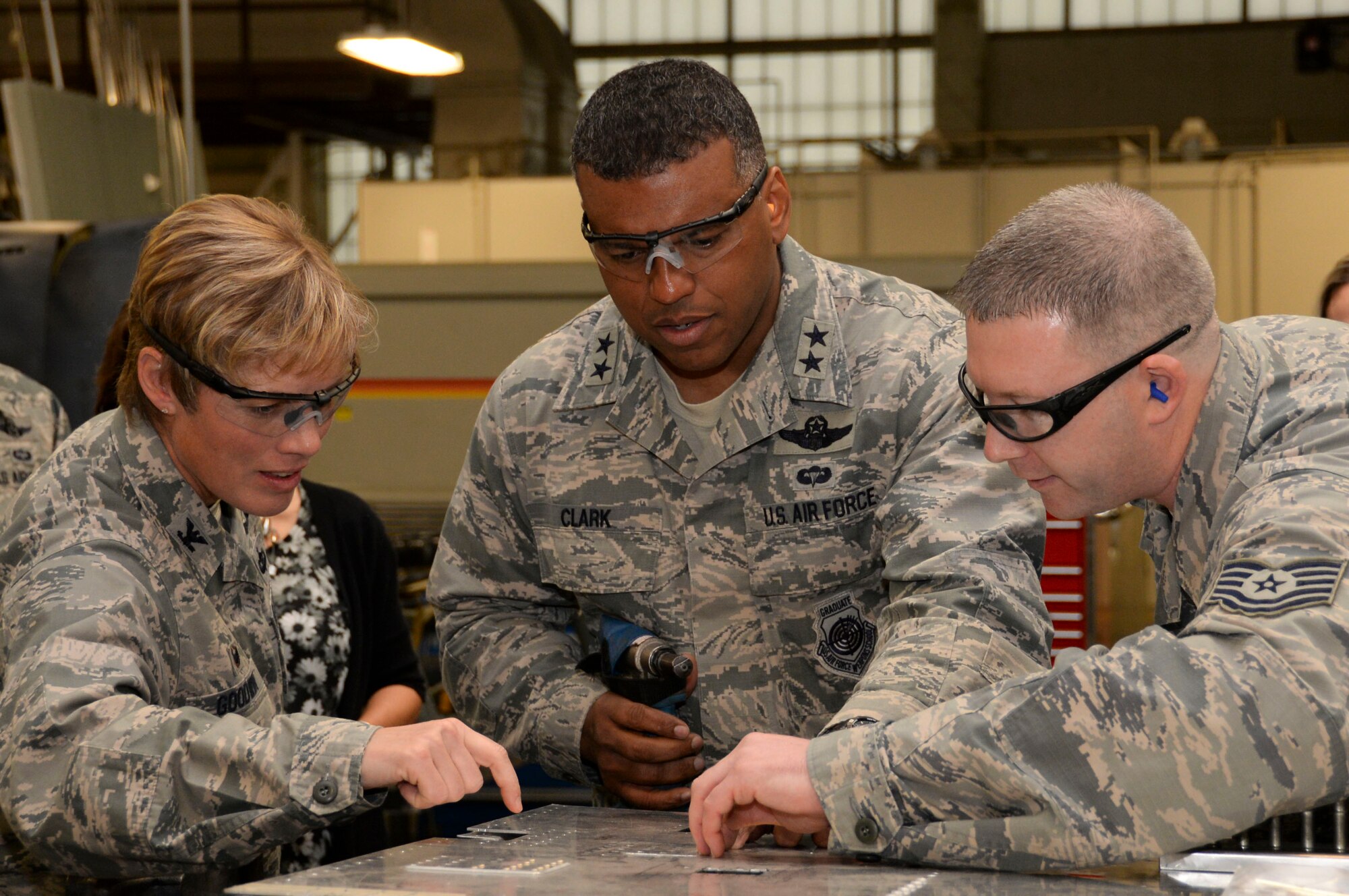 Col. Kristin Goodwin, 2nd Bomb Wing commander, and Maj. Gen. Richard Clark, Eighth Air Force commander, install rivets during Clark’s immersion tour at Barksdale Air Force Base, La., March 1, 2016. Throughout Clark’s visit, he made trips to various squadrons across base to pass along his gratitude and see first-hand how Barksdale Airmen at work. (U.S. Air Force photo/Senior Airman Amanda Morris)