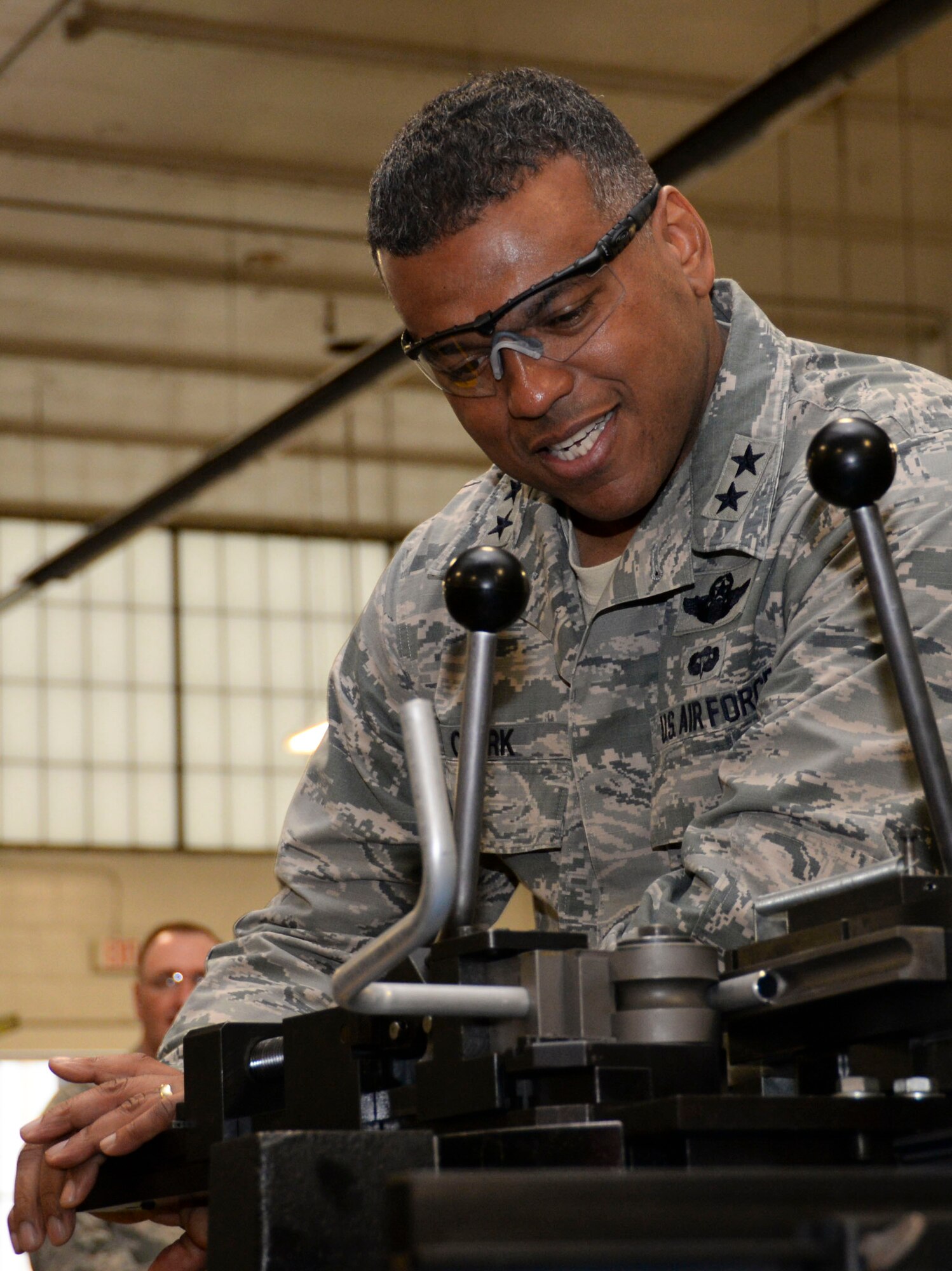Maj. Gen. Richard Clark, Eighth Air Force commander, bends tubing at the fabrication flight during his immersion tour at Barksdale Air Force Base, La., March 1, 2016. Clark had the opportunity to see how fabrication flight Airmen design and make parts for B-52 Stratofortess heavy bombers. (U.S. Air Force photo/Senior Airman Amanda Morris)