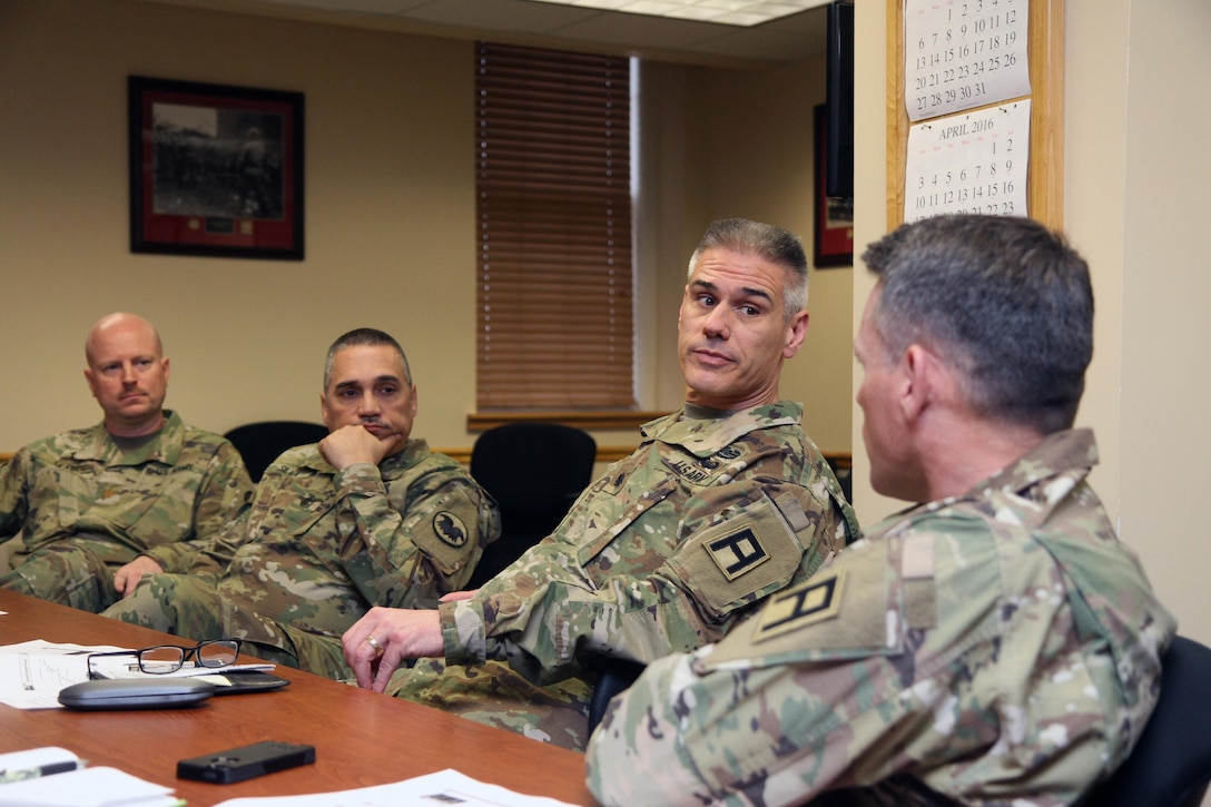 U.S. Army Reserve Lt. Col. Steven Moser, First Army Plans chaplain, second from right, listens to Sgt. Maj. Timothy Metcalf, First Army Headquarters chief chaplain assistant noncommissioned officer, during the 84th Training Command's inaugural Unit Ministry Team Workshop on Fort Knox, Ky., Feb. 17, 2016. Maj. Raymond Leach, chaplain, United States Army Reserve Command (USARC), left, and Master Sgt. Jimmy Silva, USARC, were also among the attendees. (U.S. Army Photo by Clinton Wood/Released)