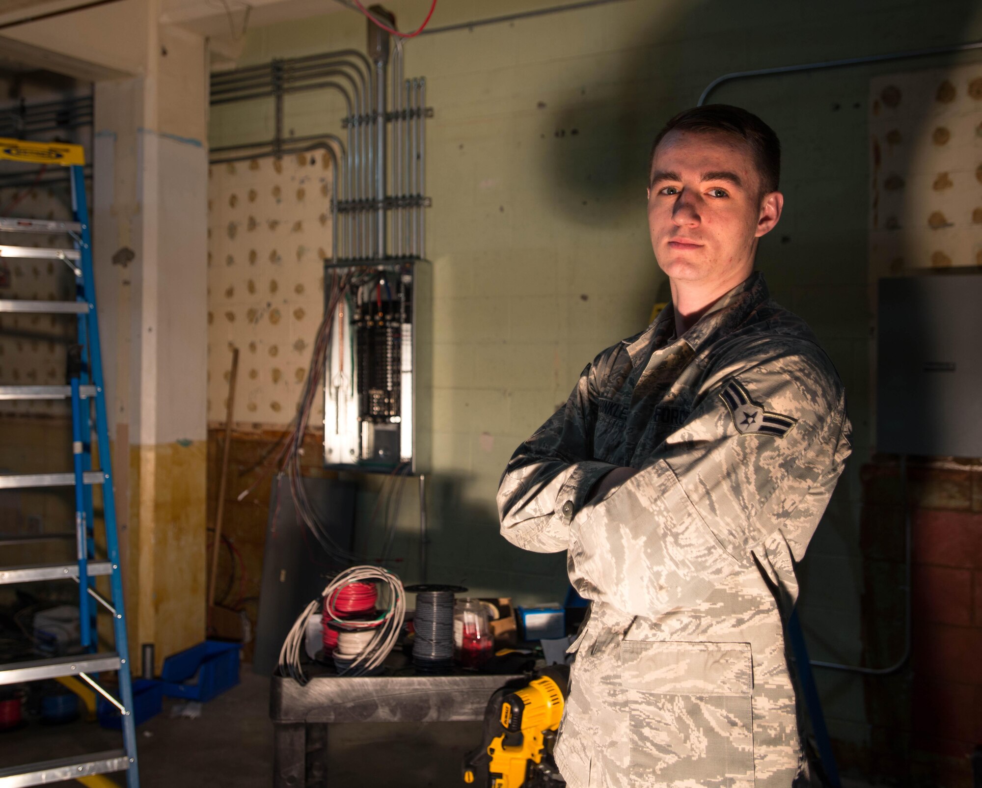 Airman 1st Class Joshua Sprinkles, a 354th Civil Engineer Squadron electrical technician, takes a break from installing electrical metallic conduit and wires in Amber Hall on March 3, 2016, at Eielson Air Force Base, Alaska. Preparing for an influx of Airmen in anticipation of the future basing of the F-35 Lightening II at Eielson, the 354th CES and contractors are remodeling offices to support missions across the U.S. Pacific Air Forces area of responsibility. (U.S. Air Force photo by Staff Sgt. Shawn Nickel/Released) 