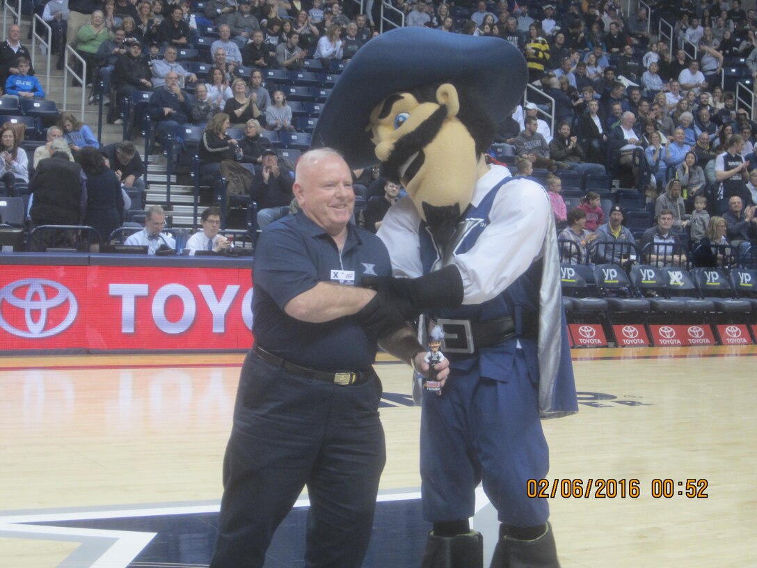 Retired Marine Bill Peters poses with the Xavier University Musketeer mascot in Oct. 2015. Peters, who lives in Dale City and volunteers as a docent at the National Museum of the Marine Corps, originated the Musketeer mascot and played the role from 1965 to 1968.