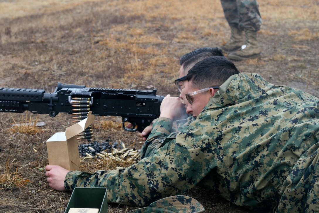 Cpl. Eliel Quiroz partners with Cpl. Jerdan Respicio to fire the crew-served M240 medium machine gun.