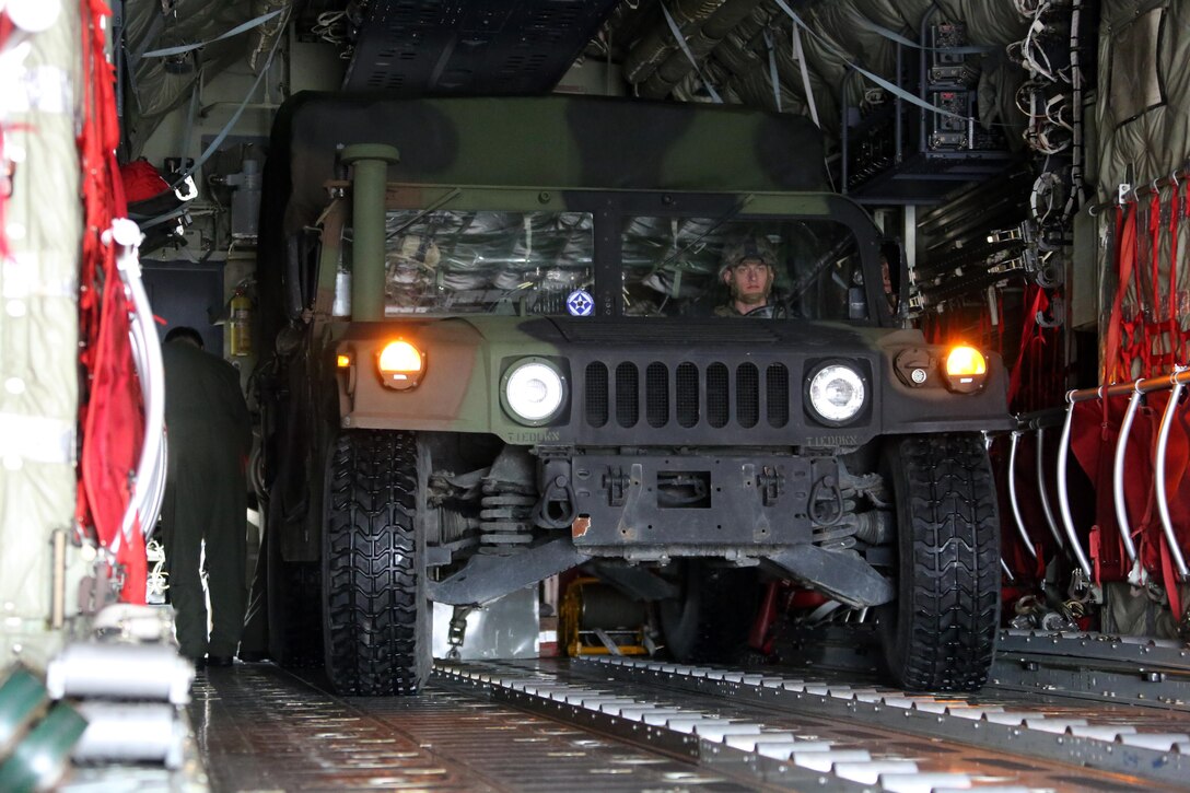 Marines load a Humvee into a KC-130J Super Hercules during cargo transportation for exercise Eager Response at Marine Corps Air Station Cherry Point, N.C., Feb. 24, 2016. During the exercise, Marines trained in events such as casualty evacuation, assault support missions and aerial refueling, proving the 2nd Marine Aircraft Wing is a highly effective combat force. (U.S. Marine Corps photo by Cpl. N.W. Huertas/ Released)