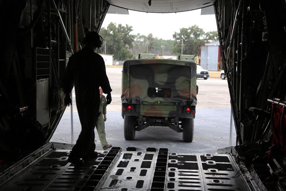 Marines unload a Humvee from a KC-130J Super Hercules during cargo transportation for exercise Eager Response at Marine Corps Air Station Cherry Point, N.C., Feb. 24, 2016. During the exercise, Marines trained in events such as casualty evacuation, assault support missions and aerial refueling, proving the 2nd Marine Aircraft Wing is a highly effective combat force. (U.S. Marine Corps photo by Cpl. N.W. Huertas/ Released)