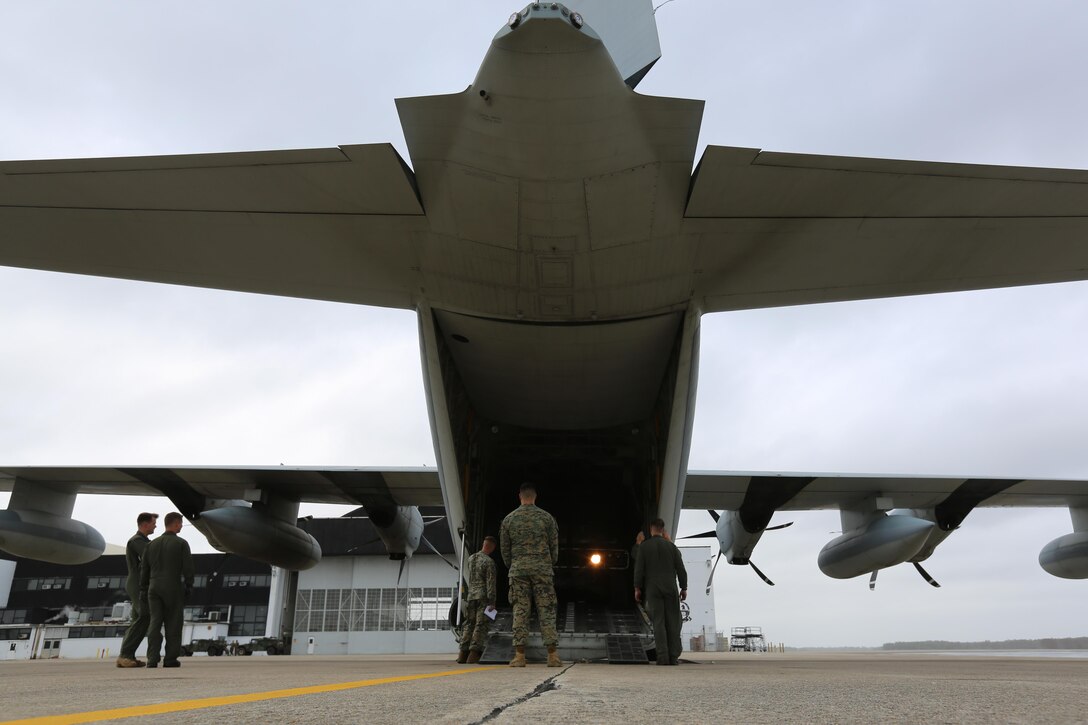 Marines load a Humvee into a KC-130J Super Hercules during cargo transportation for exercise Eager Response at Marine Corps Air Station Cherry Point, N.C., Feb. 24, 2016.  During the exercise, Marines trained in events such as casualty evacuation, assault support missions and aerial refueling, proving the 2nd Marine Aircraft Wing is a highly effective combat force. (U.S. Marine Corps photo by Cpl. N.W. Huertas/ Released)
