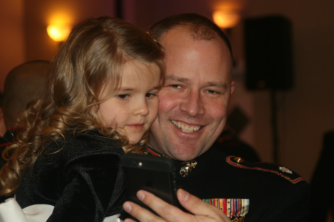 Lt. Col. Garrett Means, Manpower and Reserve Affairs, takes a selfie with daughter Elaina, 5, at the Father-Daughter Dance Feb. 26.