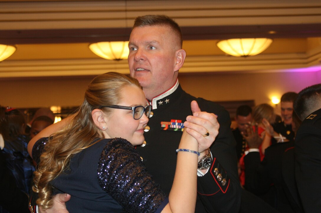 Lt. Col. Haakon Waroe, a Norwegian officer attending Command and Staff College, dances with daughter Margrethe, 12.