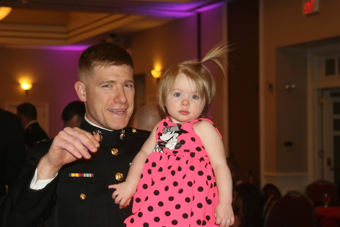 Capt. Taylor Williams, Manpower and Reserve Affairs, and daughter Piper, 1.
