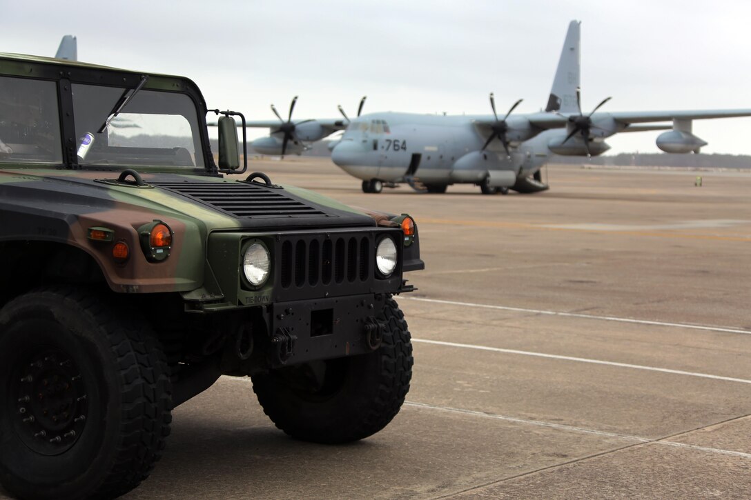 Humvees are parked on the flightline during cargo transportation in preparation for exercise Eager Response at Marine Corps Air Station Cherry Point, N.C., Feb. 24, 2016. During the exercise, Marines trained in events such as casualty evacuation, assault support missions and aerial refueling, proving the 2nd Marine Aircraft Wing is a highly effective combat force. (U.S. Marine Corps photo by Cpl. N.W. Huertas/ Released)