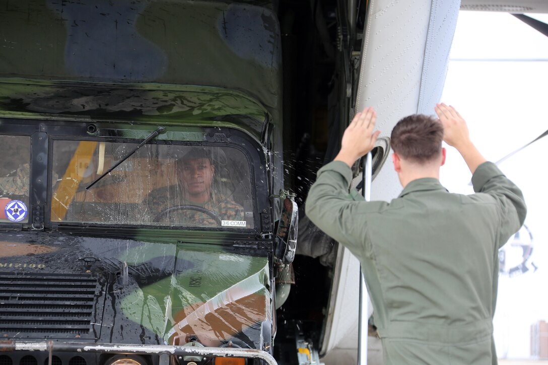 Marines load a Humvee into a KC-130J Super Hercules during cargo transportation for exercise Eager Response at Marine Corps Air Station Cherry Point, N.C., Feb. 24, 2016. During the exercise, Marines trained in events such as casualty evacuation, assault support missions and aerial refueling, proving the 2nd Marine Aircraft Wing is a highly effective combat force. (U.S. Marine Corps photo by Cpl. N.W. Huertas/ Released)