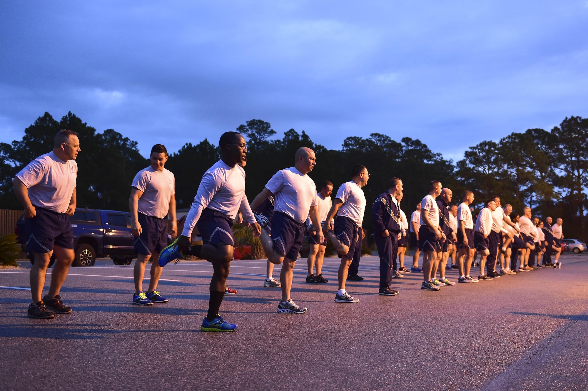 Air Force Special Operations Command’s command chiefs and newest chief master sergeant selects warm-up for a physical training session at the marina at Hurlburt Field, Fla., Feb. 23, 2016. AFSOC’s newest chief master sergeant selects and their command chiefs came to Hurlburt for a week-long chief orientation to help the new chiefs prepare for increased responsibilities as the top one percent of the enlisted force. (U.S. Air Force photo by Senior Airman Jeff Parkinson)