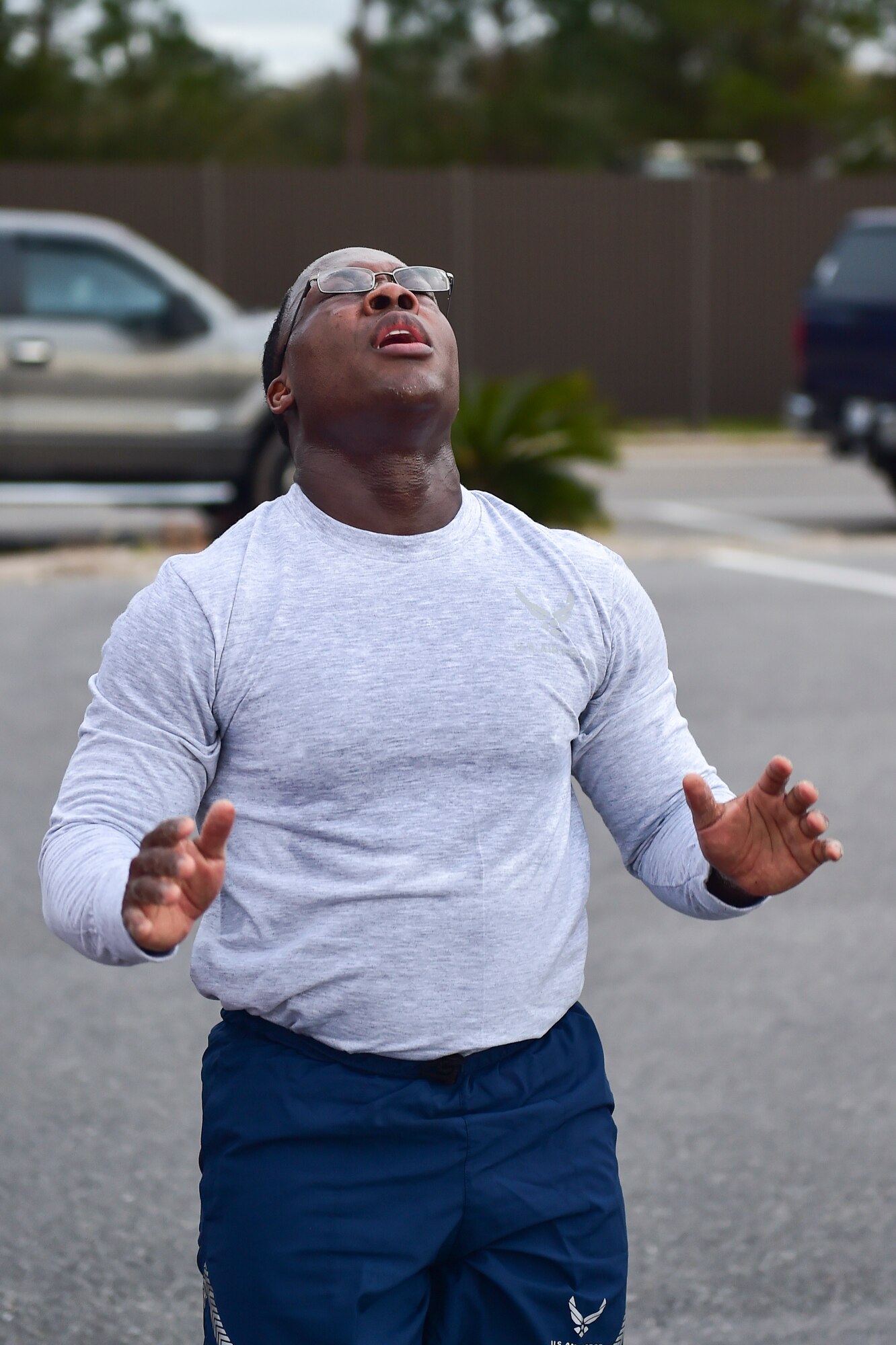 Senior Master Sgt. Leroy Burke III, administration enlisted functional manager for Air Force Special Operations Command, catches his breath while doing burpees during a physical training session at the marina at Hurlburt Field, Fla., Feb, 23, 2016. AFSOC’s newest chief master sergeant selects and their command chiefs came to Hurlburt for a week long Chief orientation to help the new chiefs prepare for increased responsibilities as the top one percent of the enlisted force. (U.S. Air Force photo by Senior Airman Jeff Parkinson)