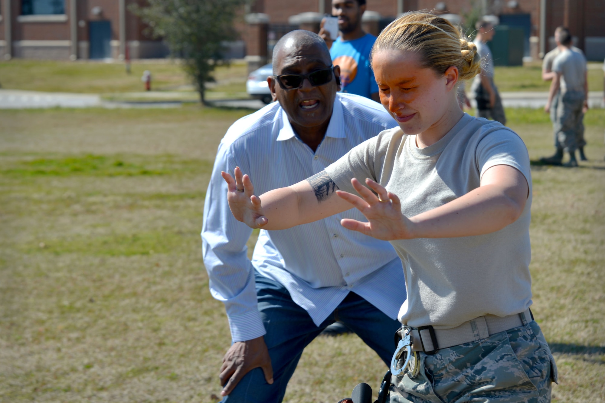 U.S Air Force Airman 1st Class Hannah McCoy, 20th Security Forces Squadron entry controller, attempts to find the next section of the pepper spray training course at Shaw Air Force Base, S.C., Feb. 29, 2016. The pepper spray training tests the Airmen to see how they would react in the event they get pepper sprayed while performing entry control duties. (U.S. Air Force photo by Senior Airman Michael Cossaboom)