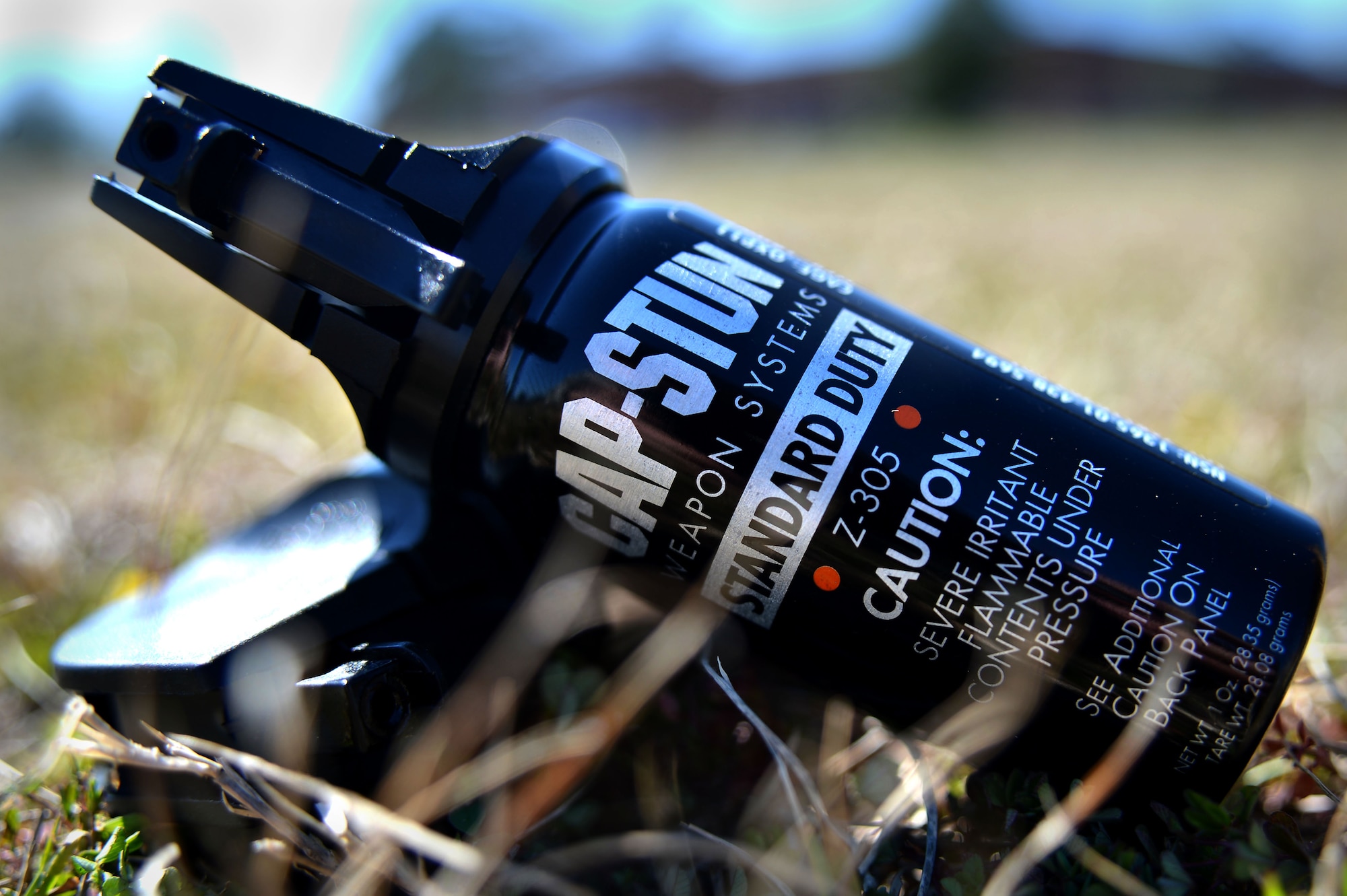 Pepper spray, also known as oleoresin capsicum, cans lay on the ground during pepper spray training at Shaw Air Force Base, S.C., Feb. 29, 2016. The duration of pepper spray effects depend on the strength of the spray, but on average it could last 45 minutes. (U.S. Air Force photo by Senior Airman Michael Cossaboom)