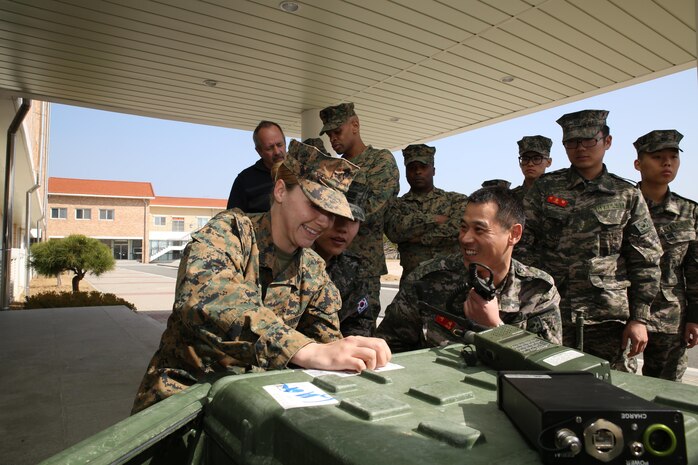 U.S. and Republic of Korea Marines work together to set up a Secure Communications Controller at the 2014 Ssang Yong exercise in Pohang, Republic of Korea. Marine Corps Systems Command is in the last stages of development of the SCC, which crosslinks incompatible radio and digital systems, making communication possible between U.S. and foreign military forces, governmental and non-governmental agencies, and among different Marine Corps radios. (Photo by Lance Cpl. Andrew Blanco, III Marine Expeditionary Force)