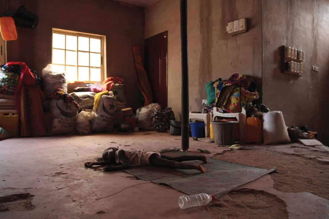 At St. Therese Church in Yola, a displaced girl rests.