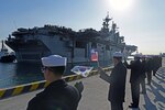 BUSAN, Republic of Korea (March 3, 2016) - Republic of Korea (ROK) Sailors wave U.S. and ROK flags as USS Bonhomme Richard (LHD 6) pulls into ROK Fleet base. Bonhomme Richard is the flagship of Expeditionary Strike Group (ESG) 7 and is visiting Busan on a regularly scheduled port visit 