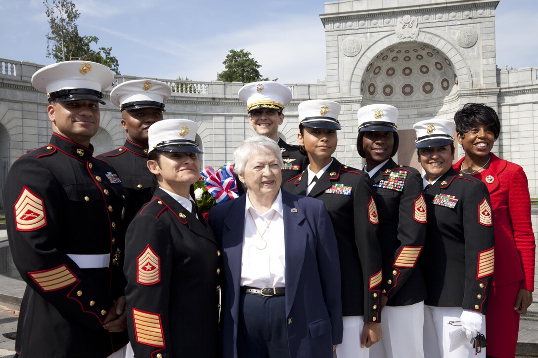 Then-President of the Women's Memorial Foundation, retired Air Force Brig. Gen. Wilma L. Vaught, front row center, poses for a photo with Marines during the 17th annual wreath laying ceremony at the Women In Military Service for America Memorial in Arlington Va., May 20, 2014. The ceremony commemorates female service members who lost their lives in combat. Marine Corps photo by Lance Cpl. Alejandro Sierras