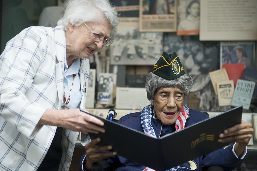 Emma "Big Mama" Didlake, right, 110 years old, receives mementos from retired U.S. Air Force Brig. Gen. Wilma L. Vaught, the president of the Women's Memorial Foundation, in the Women in Military Service for America Memorial at the Arlington National Cemetery in Arlington, Va., July 17, 2015. Didlake was the oldest known living American veteran.  (U.S. Army photo by Rachel Larue/Released)