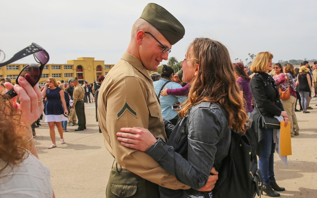 A Marine from Echo Company, 2nd Recruit Training Battalion, greets his loved one after being released for liberty at Marine Corps Recruit Depot San Diego, March 3. This is the first time Marines have seen their families and friends since arriving at the depot 13 weeks ago. Annually, more than 17,000 males recruited from the Western Recruiting Region are trained at MCRD San Diego. Echo Company is scheduled to graduate March 4.