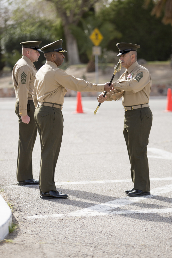 Sgt. Maj. Sergio Martinez accepts the Noncommissioned Officer sword from Base Commanding Officer, Col. Sekou S. Karega, designating him as the new base sergeant major, during a Relief and Appointment cermony held on MCLB Barstow, March 3. Sgt. Maj. Martinez took over the position from Sgt. Maj. Karl D. Simburger who has been reassigned as the sergeant major for the Wounded Warrior Regiment, located in Quantico, Va. 