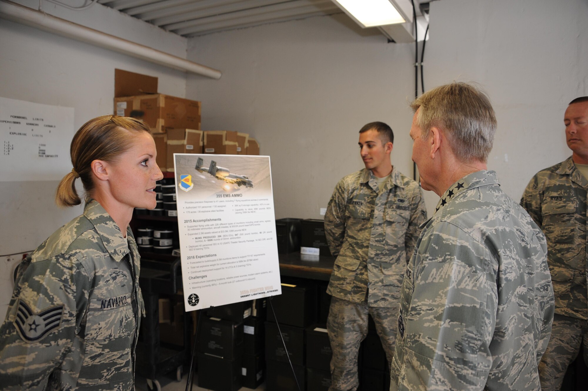 U.S. Air Force Staff Sgt. Nicole Navarro, 355th Equipment Maintenance Squadron munitions flight conventional maintenance crew chief, speaks with U.S. Air Force Gen. Hawk Carlisle, commander of Air Combat Command, at Davis-Monthan Air Force Base, Ariz., March 3, 2016. Carlisle visited various units during his tour, where Airmen briefed him about their part in completing the mission. ACC provides conventional and information warfare forces to all unified commands to ensure air, space and information superiority for warfighters and national decision-makers. (U.S. Air Force photo by Airman 1st Class Ashley Steffen/ Released)