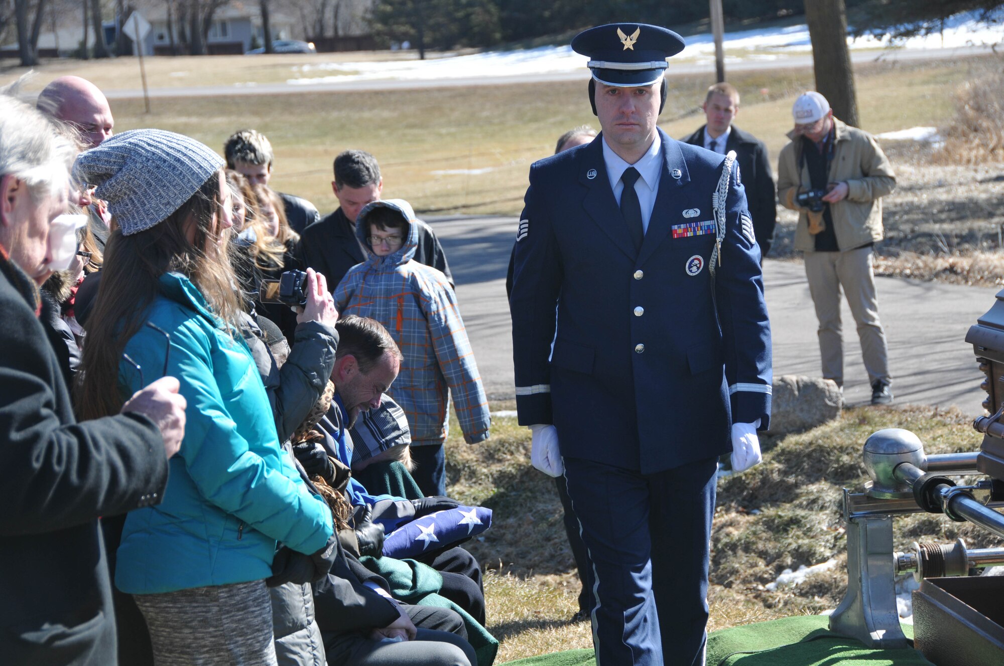 The 934th Airlift Wing Honor Guard presents the U.S. flag to the son of Col. Jerry Driscoll March 1. (Air Force Photo/Capt. William-Joseph Mojica)