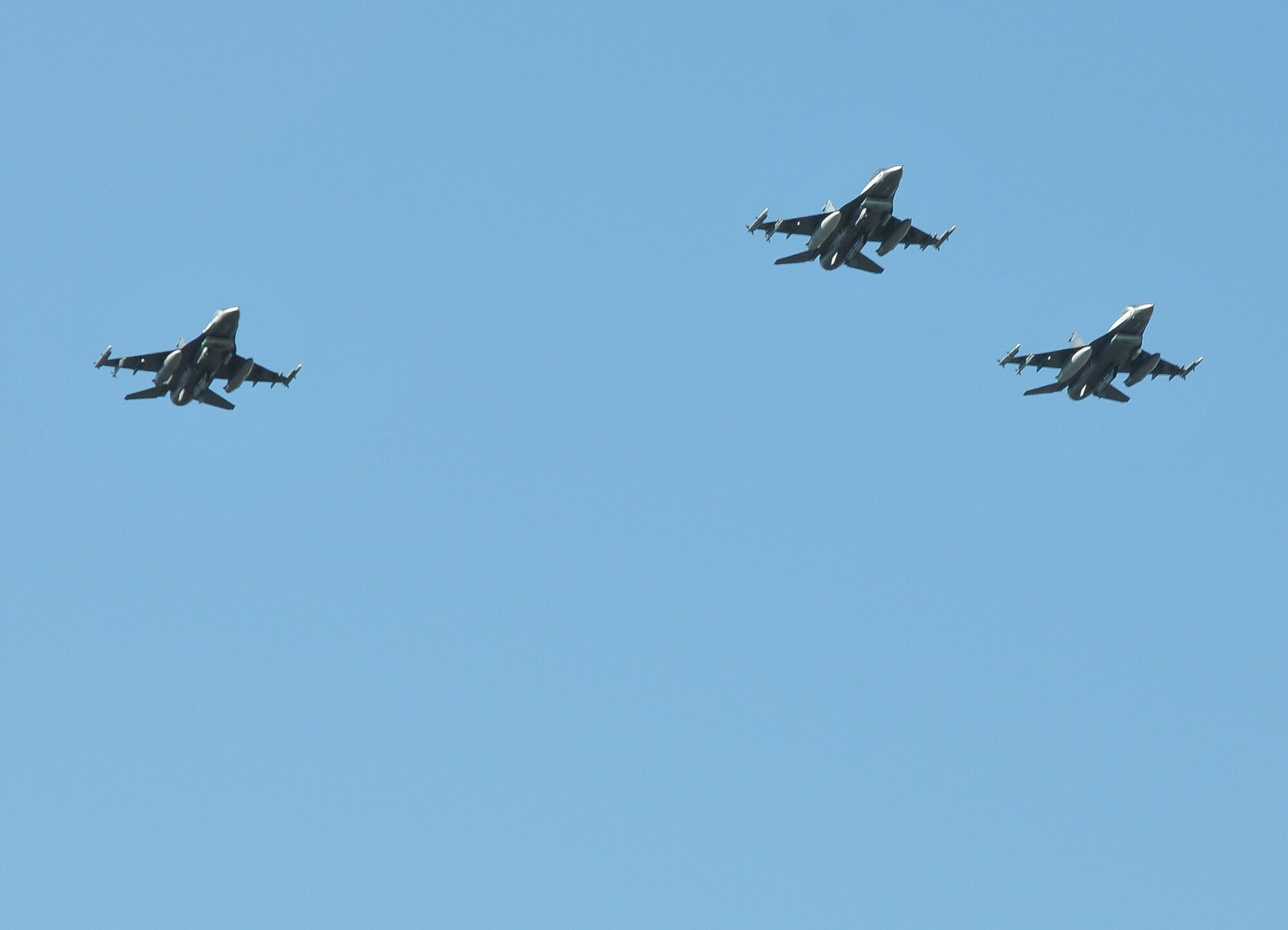 A flight of F-16s from the 148th Fighter Wing, ANG, Duluth, Minn. perform the missing man formation at the funeral of Col. Jerry Driscoll March 1. (Air Force Photo/Capt. William-Joseph Mojica)
