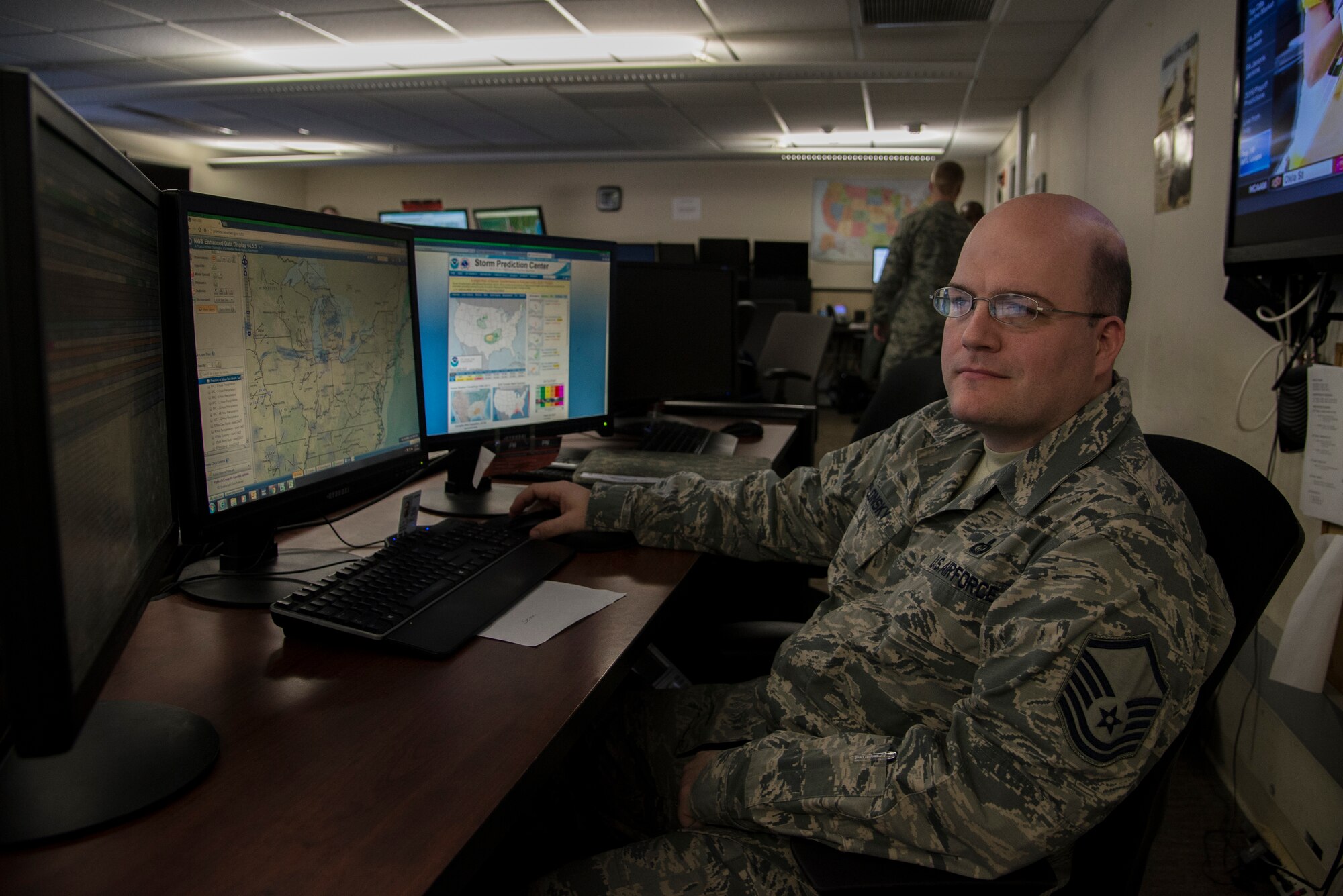 Master Sgt. Timothy Yablonsky, 15th Weather Squadron standards and evaluations NCO in charge, ensures that the weather predicted by the squadron is suitable for Air Force assets to be used in Feb 29, 2016, at Scott Air Force Base, Illinois. Yablonsky aided in the rescue of a Belleville, Illinois, family when their home was caught on fire. (U.S. Air Force photo/Senior Airman Jake Eckhardt)