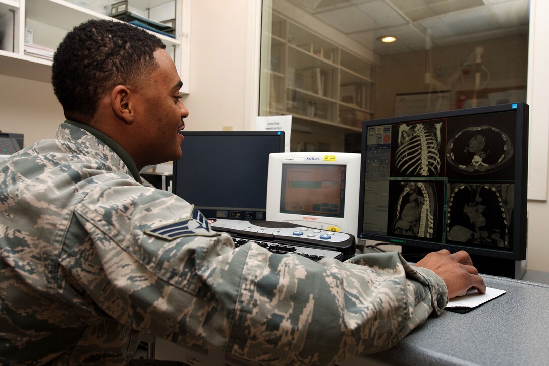 U.S. Air Force Senior Airman Glen Daniels, 633rd Surgical Operations Squadron diagnostic imaging technician, examines a CT scan at the U.S. Air Force Hospital Langley at Langley Air Force Base, Va., Feb. 19, 2016. Hospital personnel use MRI  machines’ ability to show enhanced detail to locate issues not seen while using an X-ray. (U.S. Air Force photo by Airman 1st Class Derek Seifert) 
