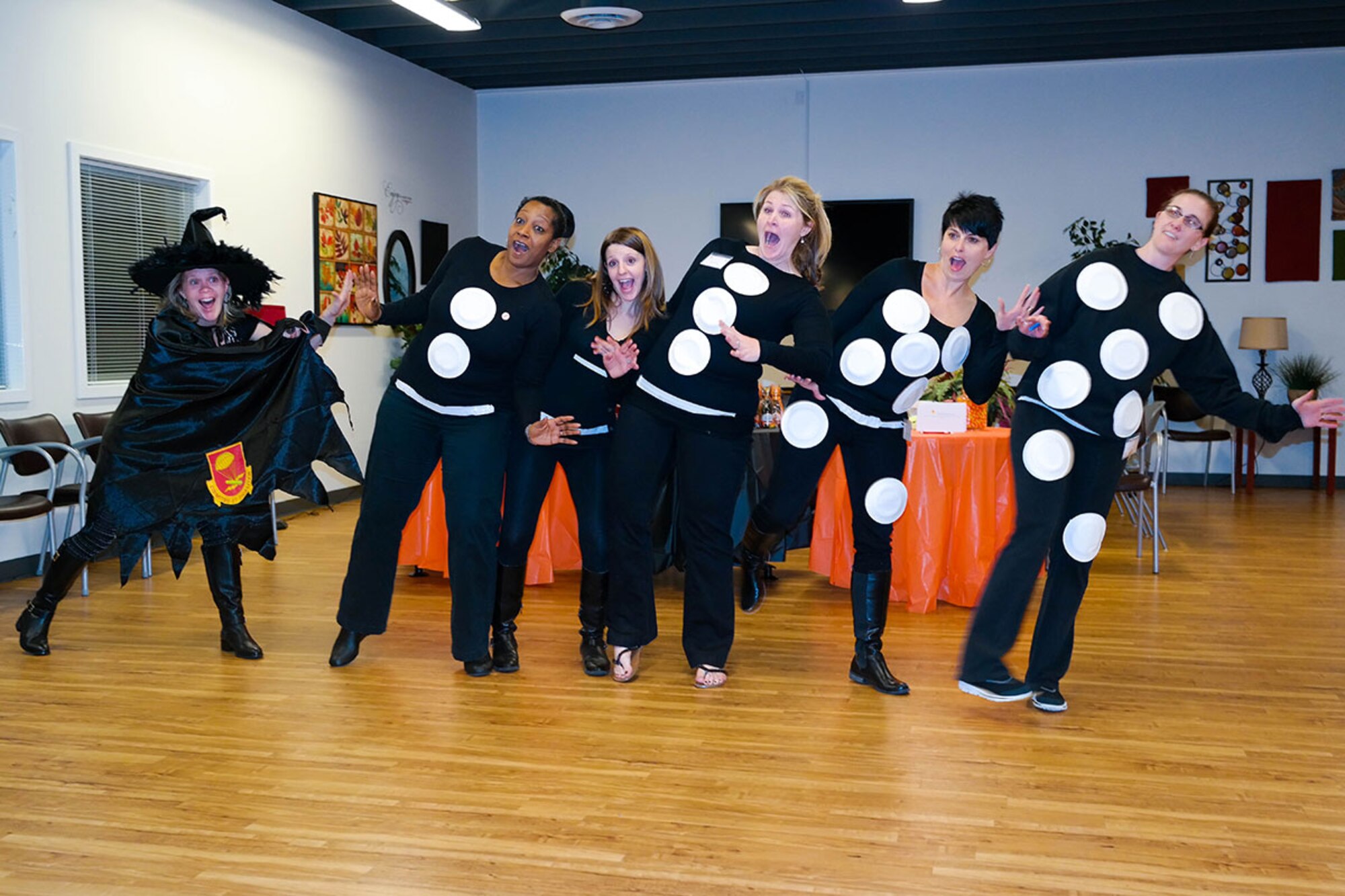 Richardson Spouses’ Club members participate in a group costume contest during a Halloween social. The RSC social gatherings allow spouses to come together to meet new people in their same situation. (Courtesy photo)