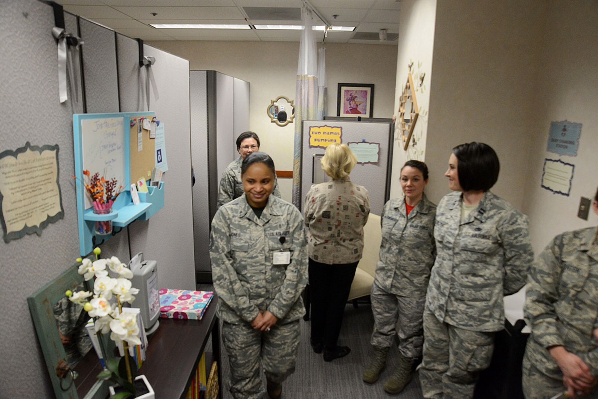 Hospital personnel tour the lactation room for the first time at the Joint Base Elmendorf-Richardson hospital Feb. 26, 2016. The room provides two nursing areas, two pumping areas, a changing table, a sink, and a microwave for sterilizing bottle and pump parts. (U.S. Air Force photo by Airman 1st Class Christopher R. Morales)