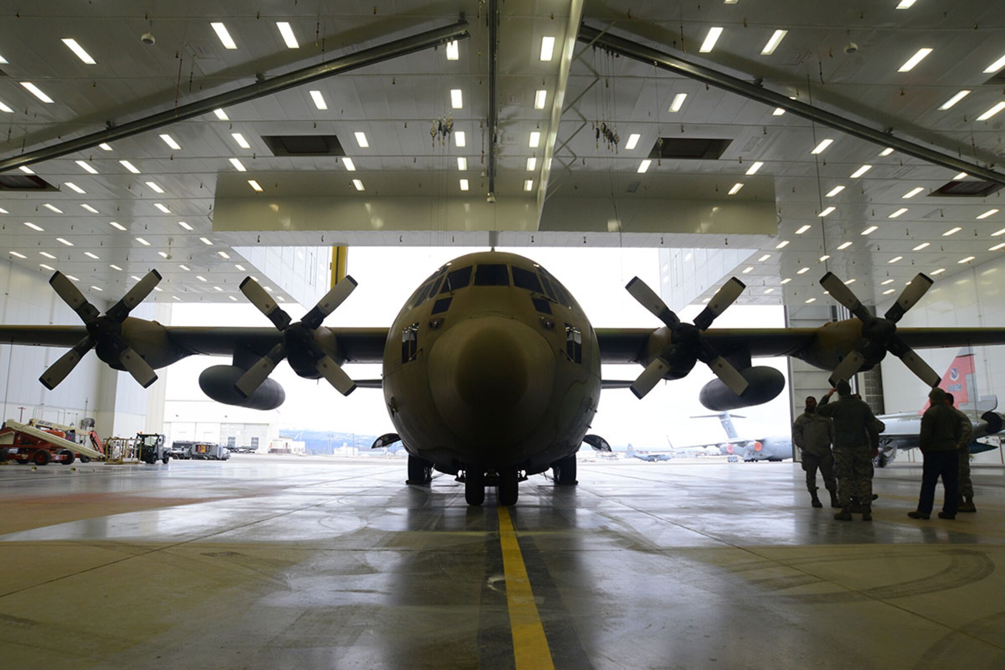 The static C-130 Hercules sits in Hangar 21 at Joint Base Elmendorf-Richardson Feb. 27, 2016. The aircraft is scheduled to be sanded, painted grey and returned to Heritage Park in April. (U.S. Air Force photo by Airman 1st Class Christopher R. Morales)