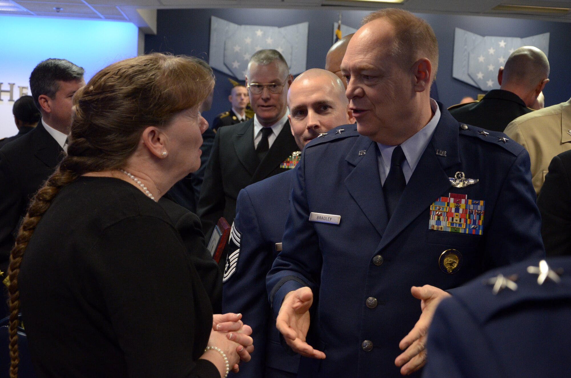 Mrs. Bonnie Rice, the 157th Air Refeuling Wing Airman and Family Readiness Program manager, speaks with Major General Kevin W. Bradley, National Guard Assistant to the Commander, United States Cyber Command and the Director, National Security Agency, after she and her support team from Pease Air National Guard Base, New Hampshire received the 2015 Department of Defense Reserve Family Readiness Award, Pentagon, Washington, D.C., Feb. 26, 2016 (U.S. Air National Guard photo by Tech. Sgt. Aaron Vezeau)