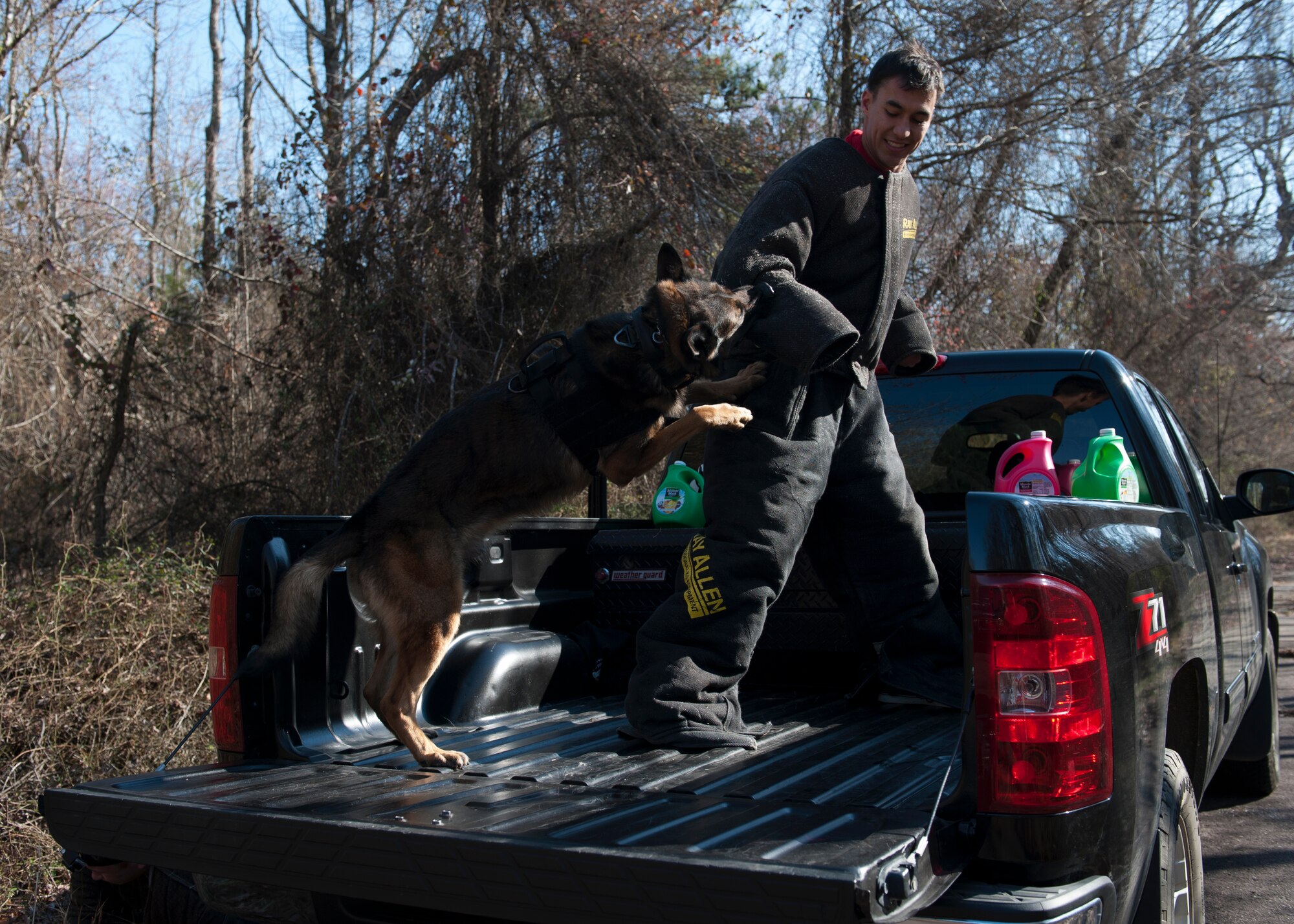 Military Working Dog Adam attacks Airman 1st Class Dylan White, a decoy, during a training scenario Feb. 25, 2016, at Little Rock Air Force Base, Ark. Military working dogs subdue their suspect by utilizing a tactic called controlled aggression. (U.S. Air Force photo by Airman 1st Class Mercedes Taylor) 
