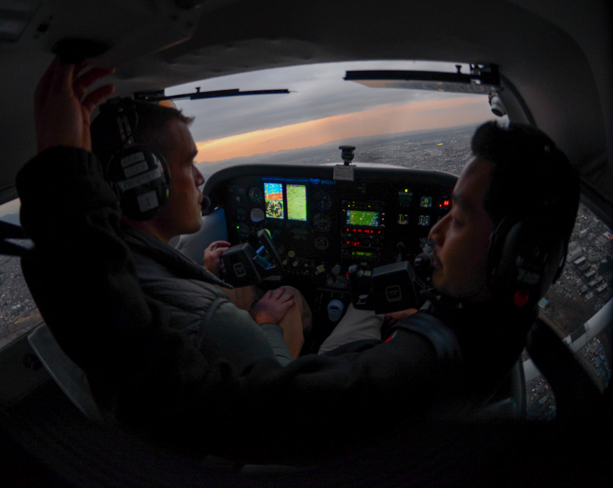 Lt. Col Andrew Campbell, 36th Airlift Squadron commander and Yokota Aero Club and Flight Training Center  student pilots a Cessna with assistance from his instructor, Shiaki Hara, at Yokota Air Base, Japan, Feb. 22, 2015. The Yokota Aero Club assigns each student an instructor who works with them one-on-one for the duration of their training. (U.S. Air Force photo by Airman 1st Class Elizabeth Baker/Released)