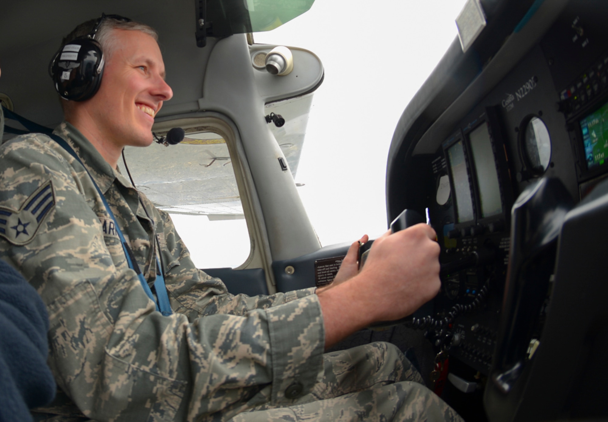 Senior Airman Justin Carnahan, 374th Airlift Wing Public Affairs broadcast journalist, pilots a Yokota Aero Club and Flight Training Center Cessna with assistance from an instructor at Yokota Air Base, Japan, Feb. 22, 2015. Earning a single engine pilot’s license typically takes six to twelve months and requires accomplishing a minimum of 40 flight hours.. (U.S. Air Force photo by Airman 1st Class Elizabeth Baker/Released)