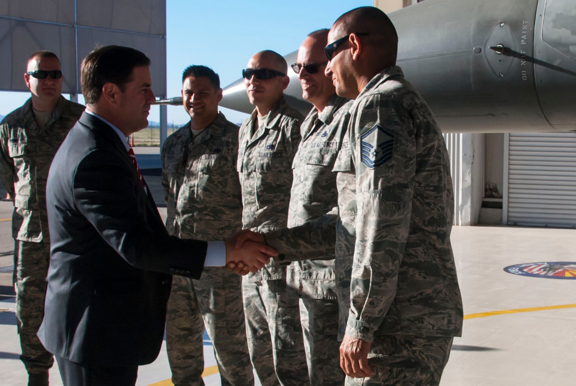 Arizona Gov. Doug Ducey greets Airmen at the Arizona Air National Guard's 162nd Aerospace Control Alert Detachment located at Davis-Monthan Air Force Base during his visit Feb. 29. The detachment team is ready 24 hours a day to deter, prevent, defeat threats aimed at our nation and when tasked provide assistance to civil authorities. (U.S. Air National Guard photo by 2nd Lt. Lacey Roberts)