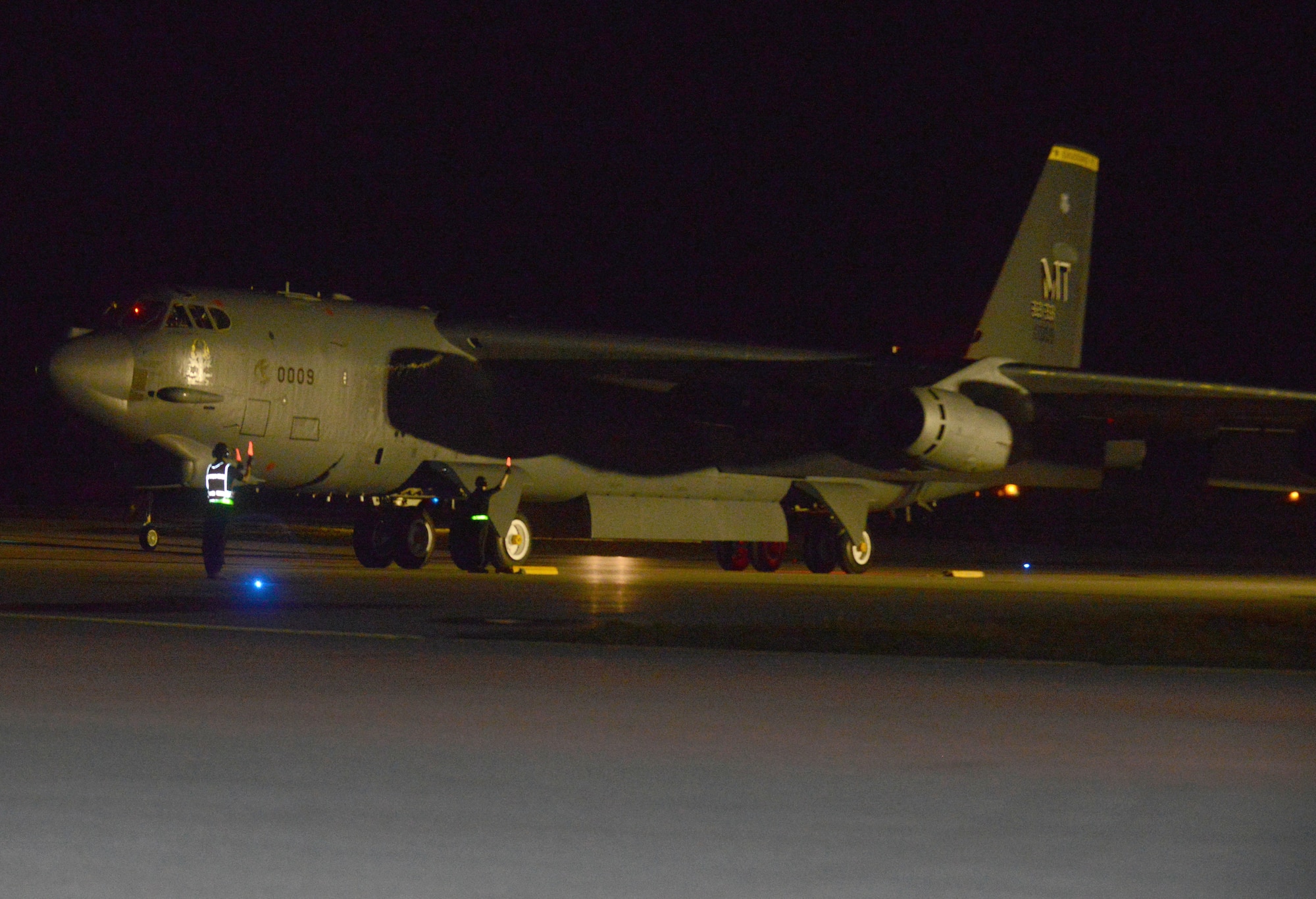 A B-52 Stratofortress from the 69th Expeditionary Bomb Squadron, deployed from Minot Air Force Base, N.D., lands March 2, 2016, at Andersen Air Force Base, Guam. A new rotation of aircrews, maintenance personnel and aircraft assigned to the 69th EBS arrived on Guam to replace the 23rd EBS in support of the U.S. Pacific Command’s continuous bomber presence mission. (U.S. Air Force photo/Airman 1st Class Arielle Vasquez)