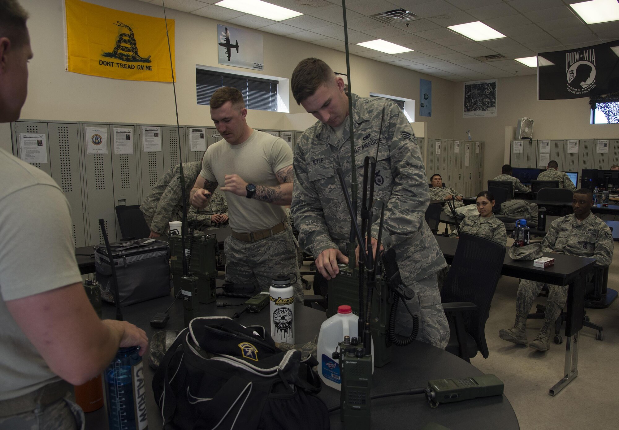 U.S. Air Force Airmen from the 823d Base Defense Squadron split into teams in preparation for an upcoming training exercise, March 2, 2016, at Moody Air Force Base, Ga. Airmen prepared for an upcoming exercise by setting up living quarters, hooking up generators, and configuring radios for communications in preparation for what they will do while simulating scenarios in the field.
 (U.S. Air Force photo by Airman 1st Class Janiqua P. Robinson/Released)
