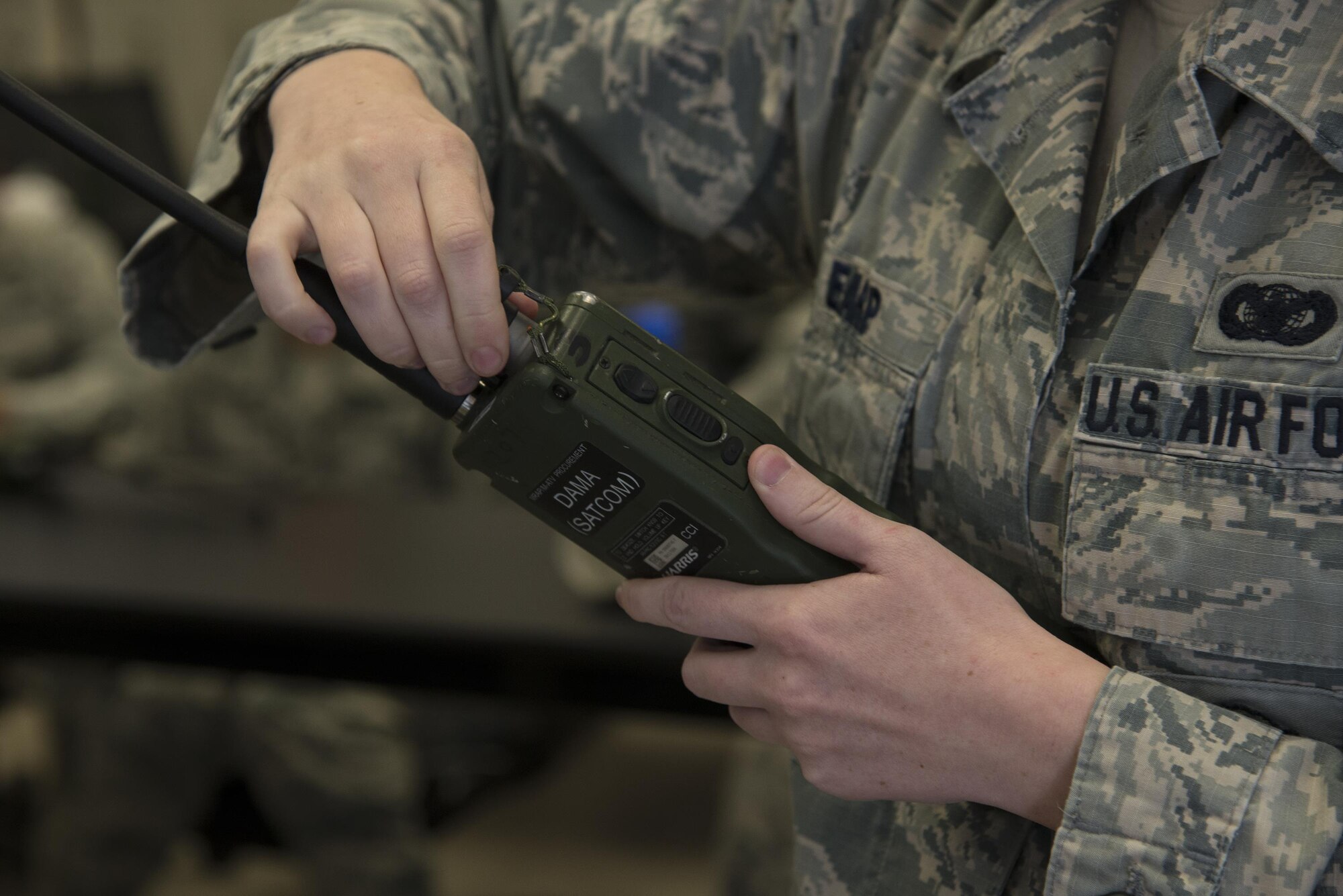 U.S. Air Force Senior Airman Morgan Earp, 823d Base Defense Squadron fire team member, programs a handheld radio in preparation for an upcoming training exercise, March 2, 2016, at Moody Air Force Base, Ga. The 823d BDS trains regularly to maintain readiness to become part of the Global Response Force, which is tasked to be ready for any mission, anywhere within 72-hours of notification.
(U.S. Air Force photo by Airman 1st Class Janiqua P. Robinson/Released)