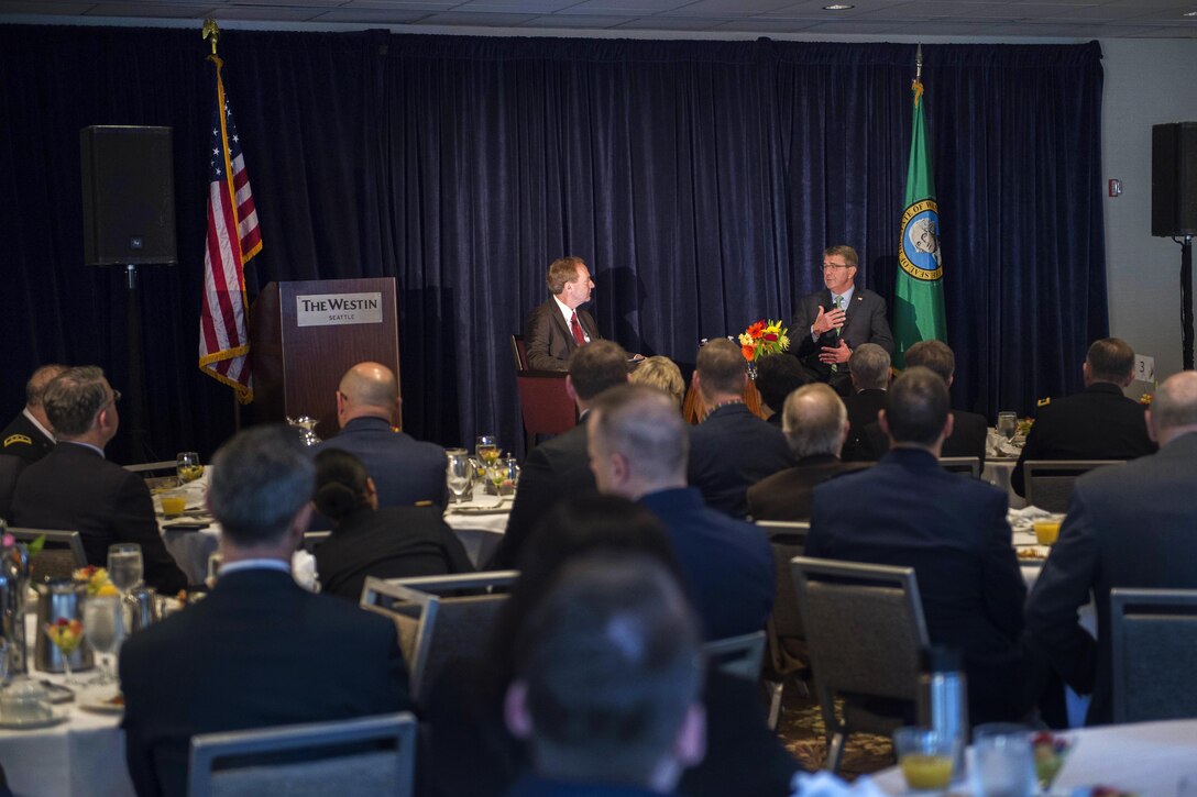 Defense Secretary Ash Carter, right, answers questions from Microsoft President Brad Smith in Seattle, March 3, 2016. Carter spoke at a Microsoft-hosted breakfast as part of his efforts to strengthen ties between the Department of Defense and the tech community. DoD photo by Navy Petty Officer 1st Class Tim D. Godbee
