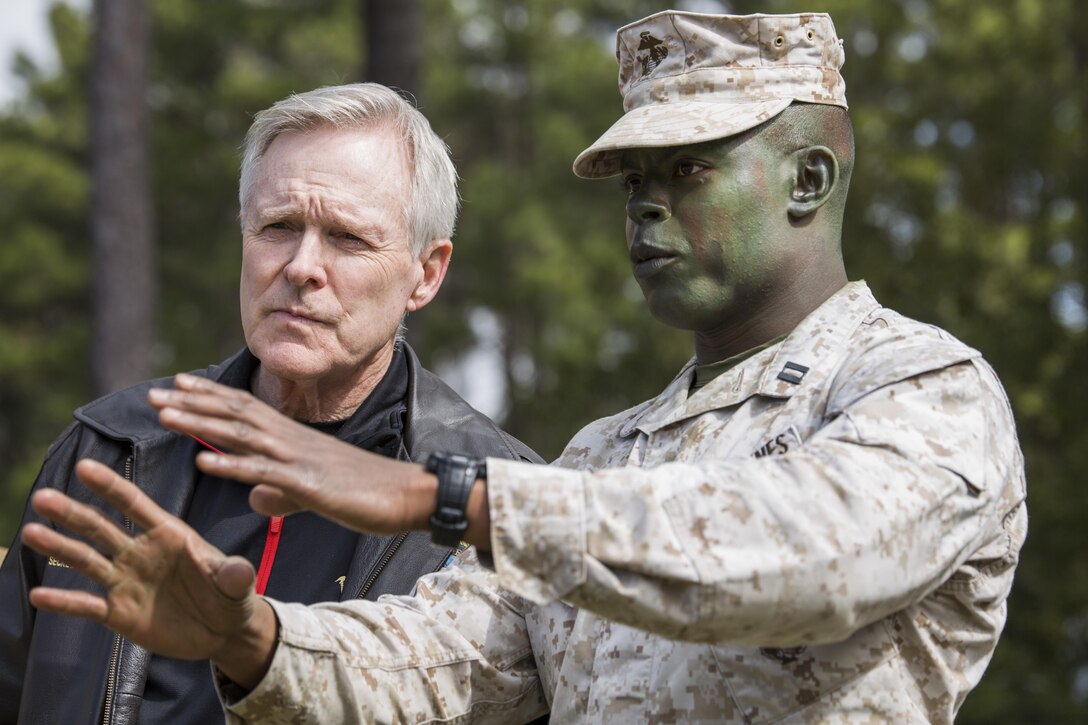 Secretary of the Navy Ray Mabus, left, speaks with Capt. Larry Black Jr., commander of Delta Company, 1st Recruit Training Battalion, about training March 3, 2016, on Parris Island, S.C. Mabus visited Marine Corps Recruit Depot Parris Island in order to see firsthand how young men and women from across the country are transformed into United States Marines. Recruit training was consolidated under Recruit Training Regiment in 1986, and since then, all those desiring to complete recruit training must follow the same training program of instruction, and must complete the same graduation requirements. (Photo by Staff Sgt. Greg Thomas)