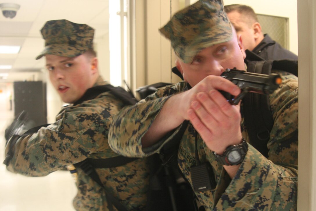Members of SRT Marines commence search/engagement of "shooter" in Active Shooter Exercise in Lejeune Hall on March 2, 2016.