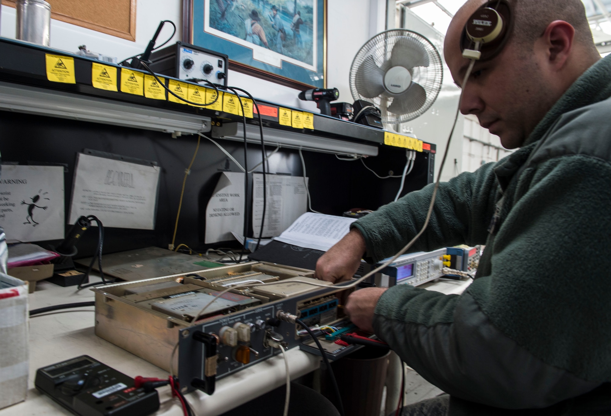 Staff Sgt. Derrick Shelton, 424th Air Base Squadron airfield systems technician, repairs a radio at Chièvres Air Base, Belgium, Feb. 25, 2016. Airmen from the 424th ABS provide airfield operations support for the Supreme Allied Commander Europe and Supreme Headquarters Allied Powers Europe, NATO transient aircraft and distinguished visitors. (U.S. Air Force photo/Staff Sgt. Sara Keller)