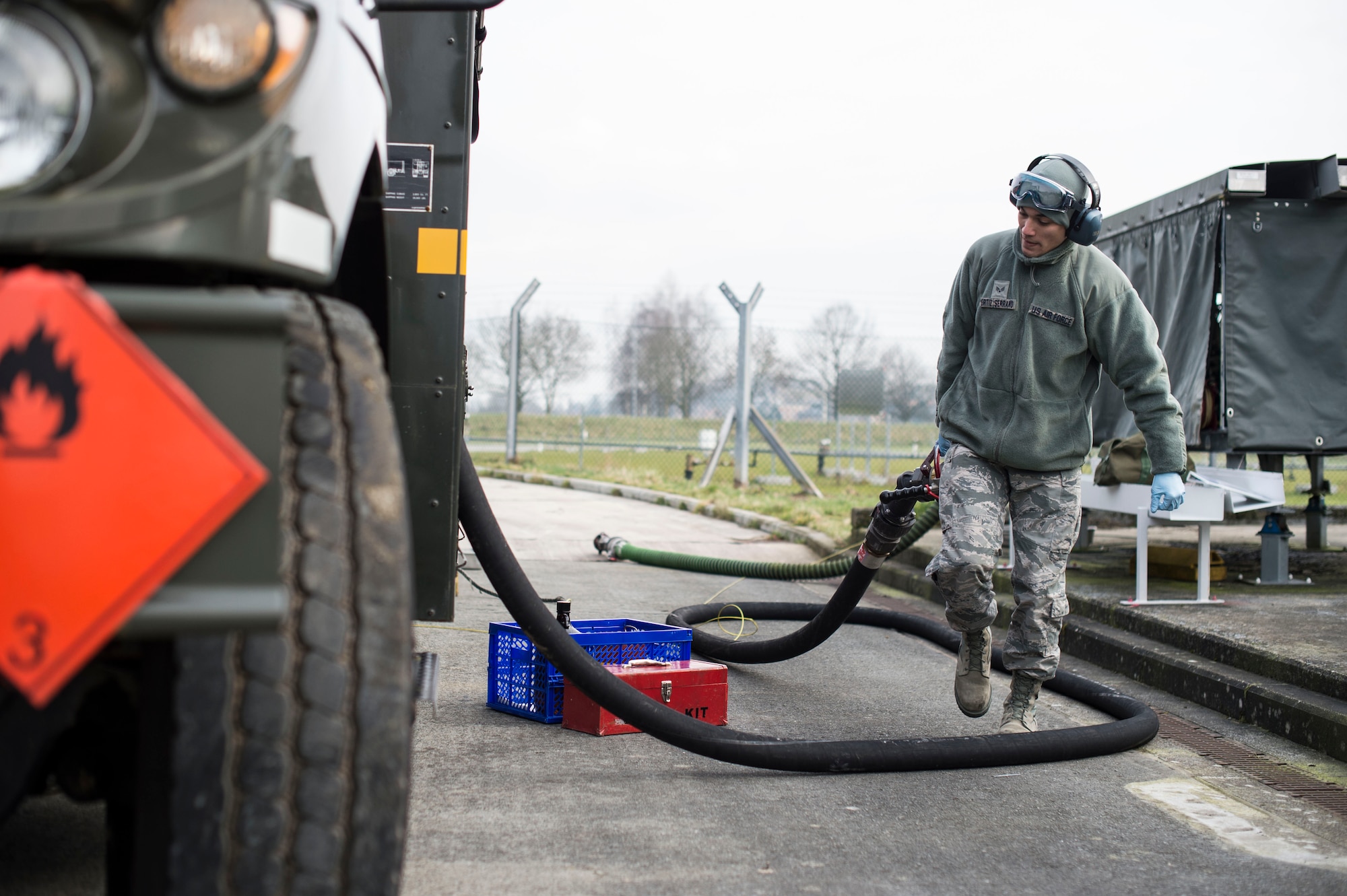Senior Airman Julian Ortiz-Serrano, a 424th Air Base Squadron fuels management technician, stows a hose after refilling a fuel truck at Chièvres Air Base, Belgium, Feb. 25, 2016. Romero is one of 70 Airmen assigned to the 424th ABS. (U.S. Air Force photo/Staff Sgt. Sara Keller)