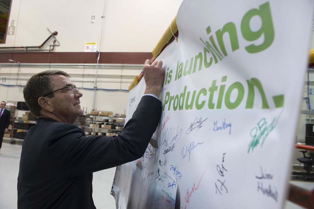 Defense Secretary Ash Carter signs his name to the Boeing guest board in Seattle, March 3, 2016. DoD photo by Navy Petty Officer 1st Class Tim D. Godbee
