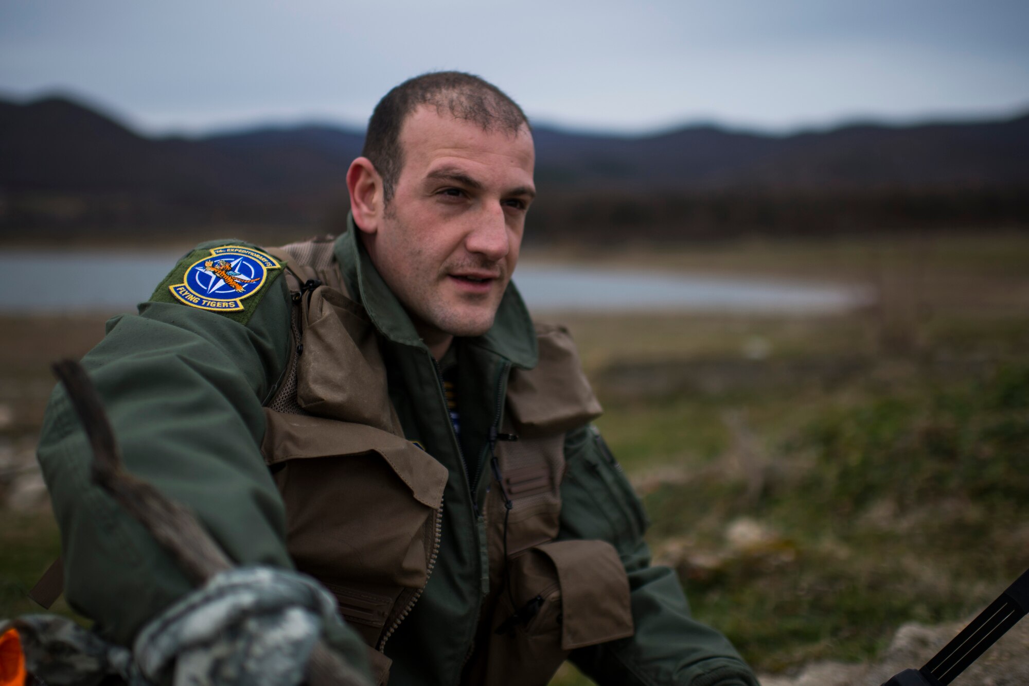 PLOVDIV, Bulgaria - Italian air force Captain Roberto Manzo, a 74th Expeditionary Fighter Squadron A-10C Thunderbolt II aircraft exchange pilot, looks off into the distance during combat search and rescue training near Plovdiv, Bulgaria, Feb. 11, 2016. Manzo is part of a pilot exchange program allowing him to train as an A-10 pilot with the 74th EFS, assigned to the 23rd Wing at Moody Air Force Base, Ga. (U.S. Air Force photo by Airman 1st Class Luke Kitterman/Released)