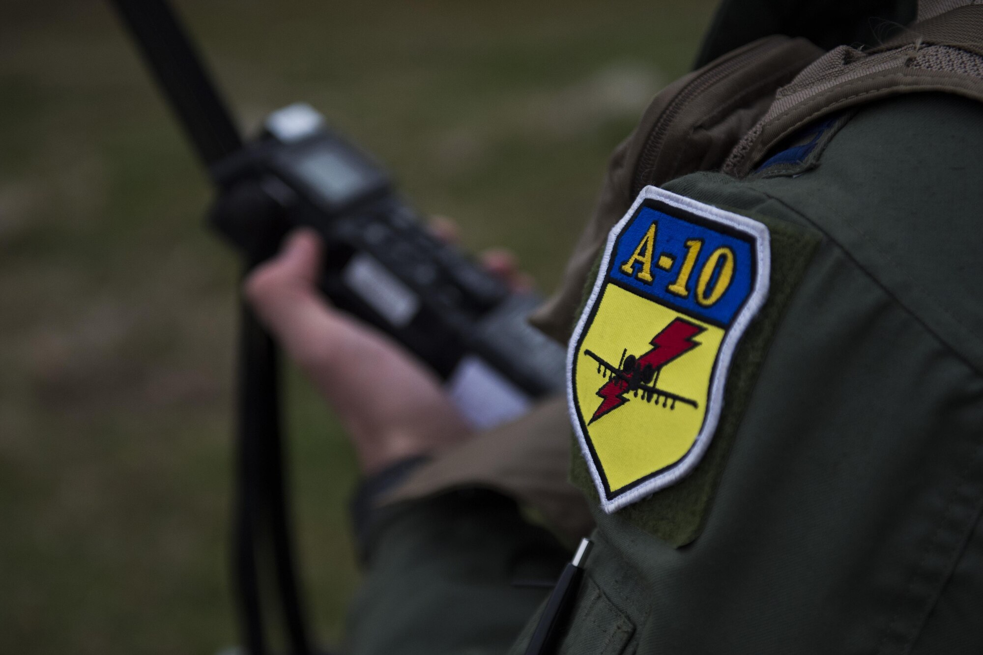 PLOVDIV, Bulgaria - A patch is displayed on the shoulder of Italian air force Captain Roberto Manzo, a 74th Expeditionary Fighter Squadron A-10C Thunderbolt II aircraft exchange pilot, during combat search and rescue training near Plovdiv, Bulgaria, Feb. 11, 2016. Manzo used a radio and played the role of ‘survivor’ during the CSAR training which involved four A-10s working together with Bulgarian Special Forces. (U.S. Air Force photo by Airman 1st Class Luke Kitterman/Released)