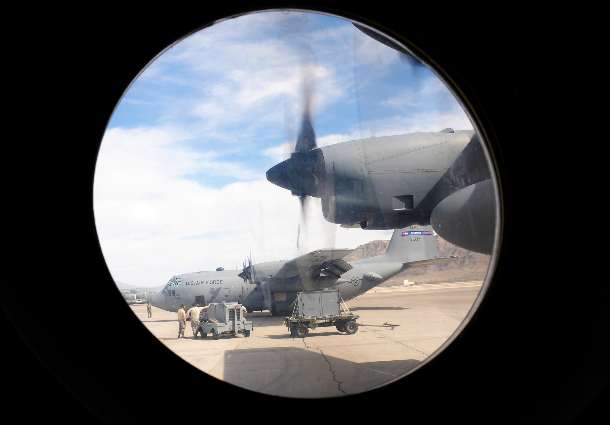 Engines on C-130 Hercules’ from Dobbins Air Reserve Base, Ga. start for take off during Red Flag 16-2 at Nellis Air Force Base, Nev. March 1, 2016. Red Flag missions are conducted on the 2.9 million acre Nevada Testing and Training Range with 1,900 possible targets, realistic threat systems and opposing enemy forces. (U.S. Air Force photo/Staff Sgt. Daniel Phelps)
